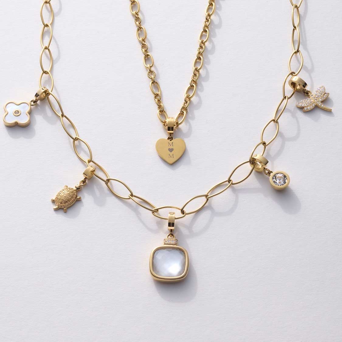 Anhänger VIRGINIA gold Clip & Mix mit verschiedenen Charms auf weißem Hintergrund