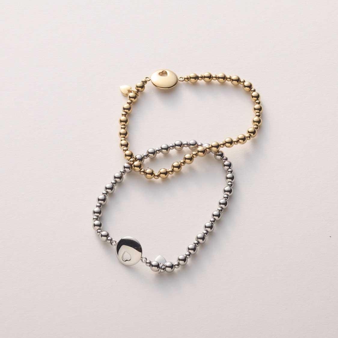 Armband SUE AMOUR gold mit silbernen Kugelketten auf weißem Hintergrund