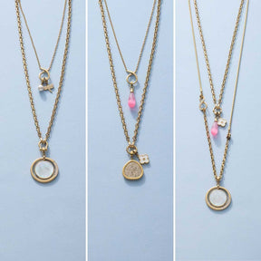 Drei Varianten der Halskette YVETTE mit austauschbaren Clips in Gold mit verschiedenen Anhängern