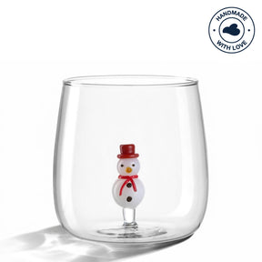 Trinkglas RIPOSO mit Schneemann-Figur am Boden, klares Glas, Studioaufnahme