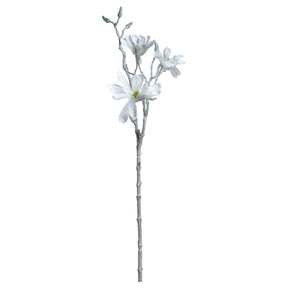 Weiße künstliche Magnolie mit Blüten und Knospen auf grauem Stiel