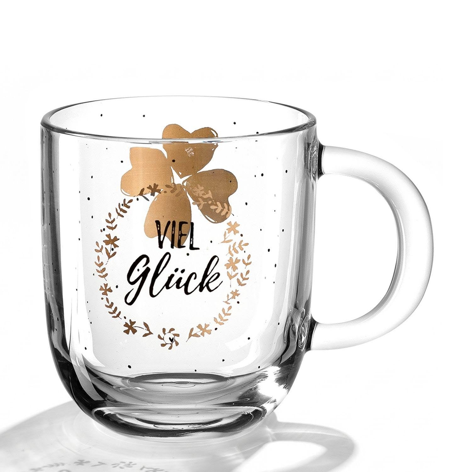 Tasse EMOZIONE mit Kleeblatt-Motiv und "Viel Glück"-Schriftzug auf weißem Hintergrund