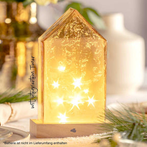 LED Haus 22 cm amber MAGICO mit leuchtenden Sternen auf Tisch mit Deko