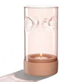 Tischlicht auf Sockel SOLE mit brennender Kerze, apricot Glas und Beton